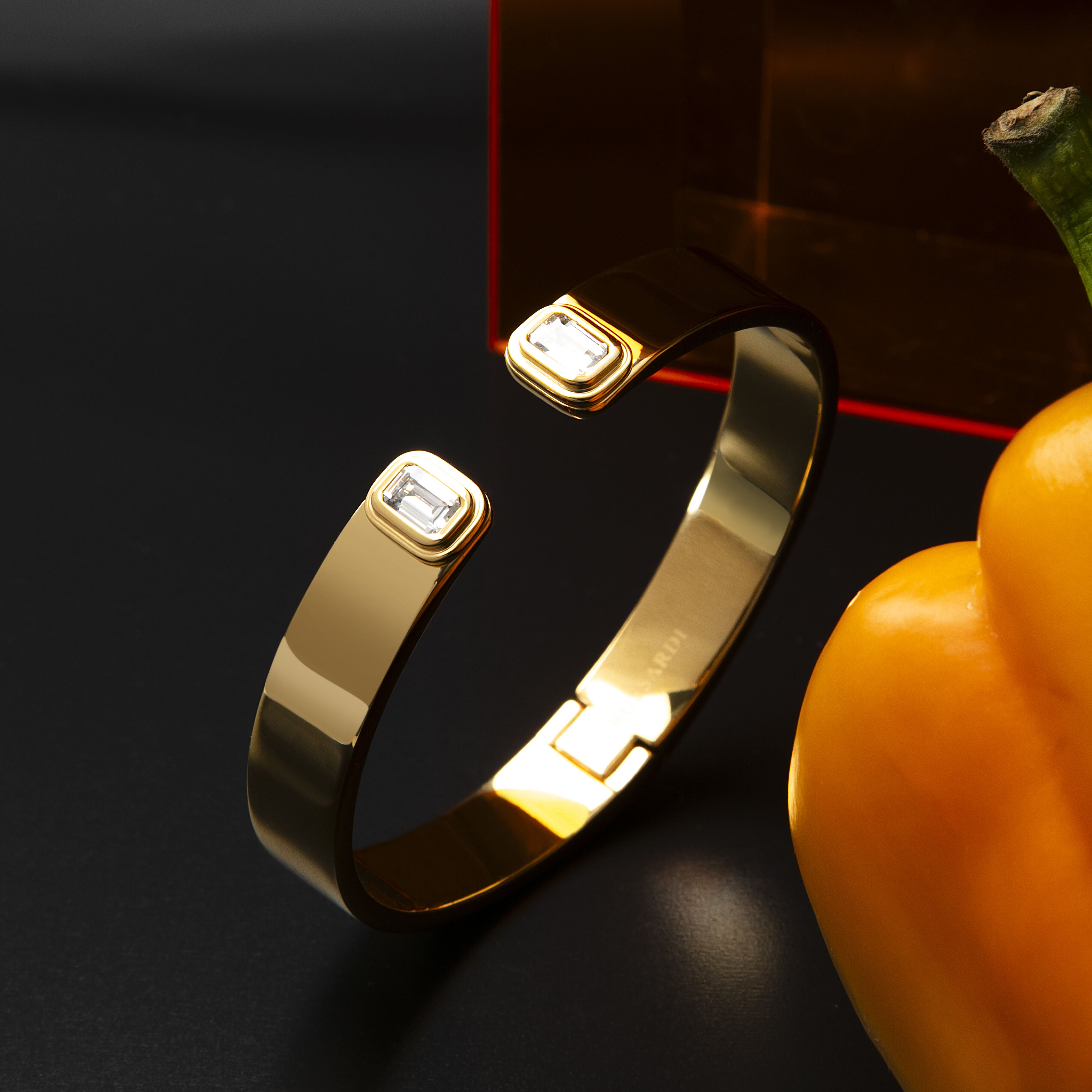 Women’s T-Design bangle in stainless steel with yellow gold finish, Trussardi
